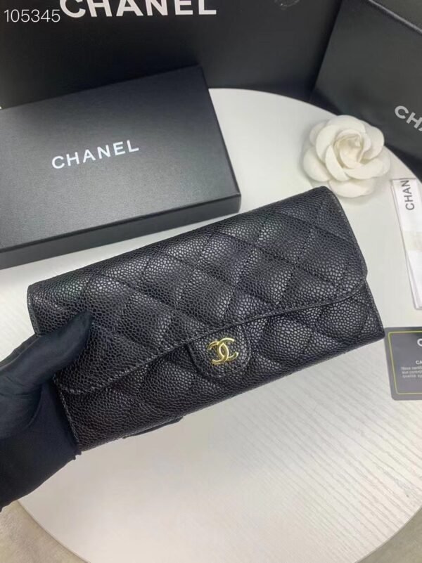 Chanel wallet in black caviar leather with gold hardware