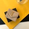 CASSANDRE MATELASSÉ COMPACT TRI-FOLD WALLET IN LAMBSKIN