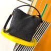 LE 37 IN WOVEN RAFFIA AND VEGETABLE-TANNED LEATHER