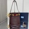 Prada Buckle leather bucket bag with jeweled belt
