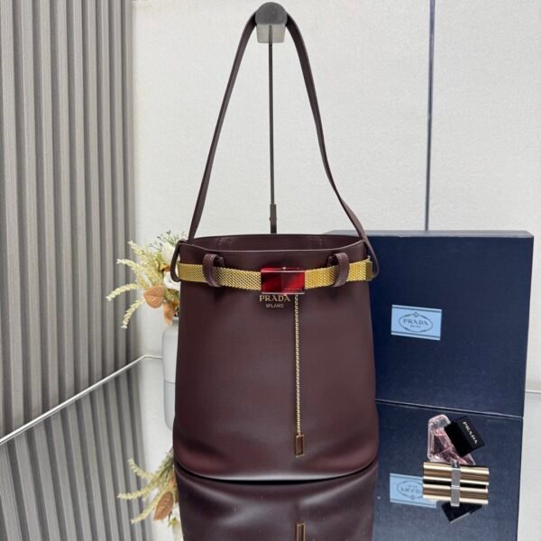 Prada Buckle leather bucket bag with jeweled belt