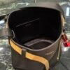 Prada Buckle leather bucket bag with jeweled belt