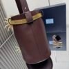 Prada Buckle leather bucket bag with jeweled belt