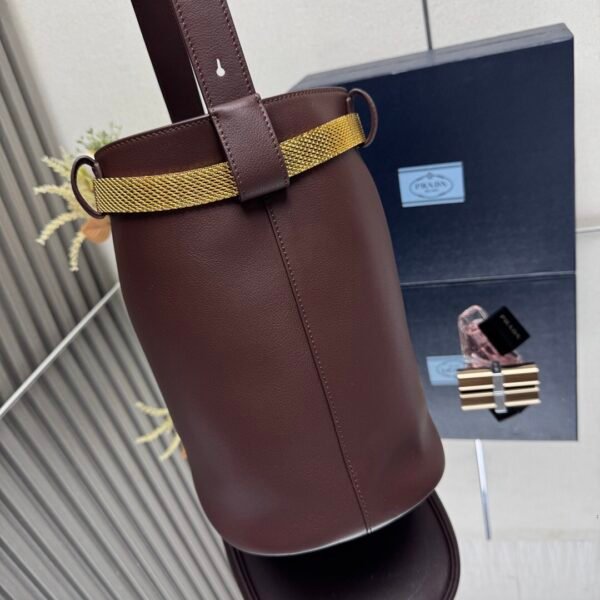 Prada Buckle leather bucket bag with jeweled belt