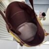 Prada Buckle leather bucket bag with jeweled belt