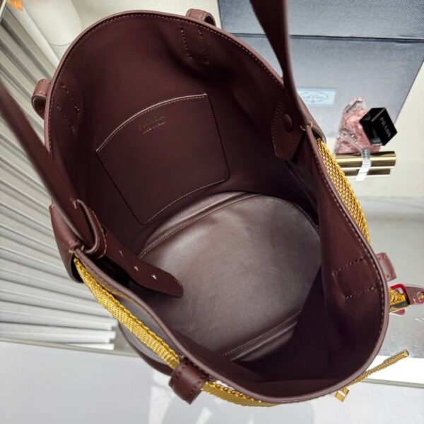 Prada Buckle leather bucket bag with jeweled belt