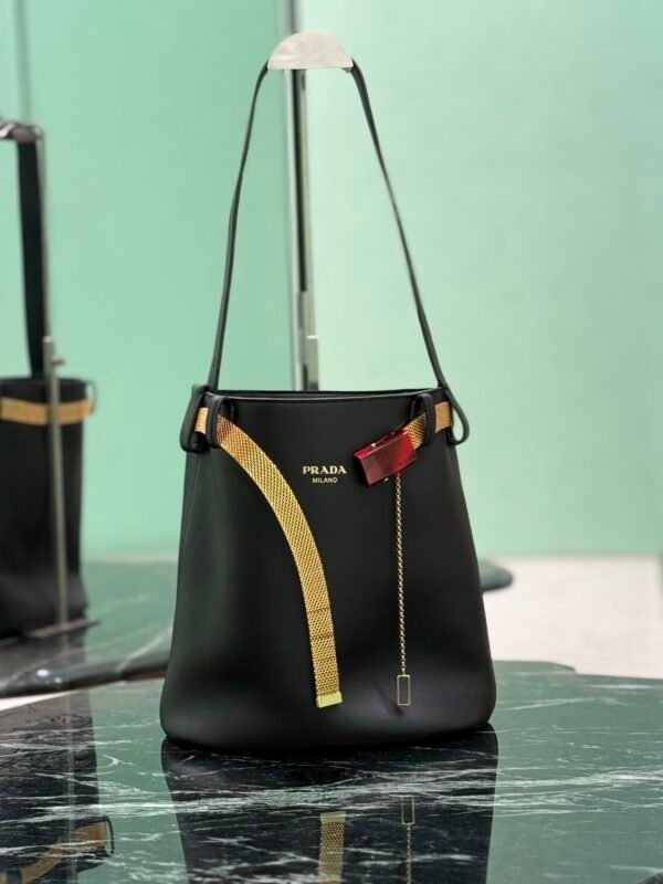 Prada Buckle leather bucket bag with jeweled belt