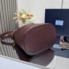 Prada Buckle leather bucket bag with jeweled belt