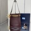 Prada Buckle leather bucket bag with jeweled belt