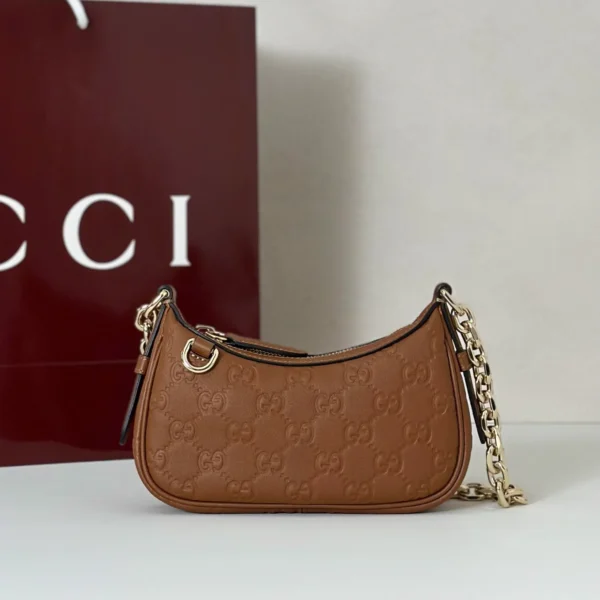 847091 AAFDV 6207-2 (1) Gucci GG Emblem Debossed Leather Mini Shoulder Bag
